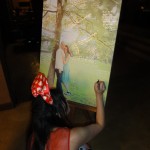 Kat signing the canvas photo
