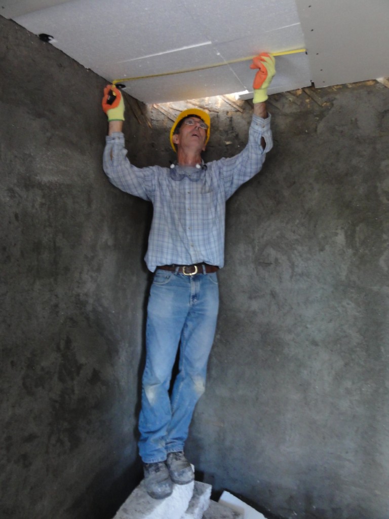 Nick measuring up the plasterboard