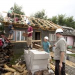 Moving a lot of tiles onto the roof of the smaller house