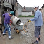 Ady and Martin mixing cement