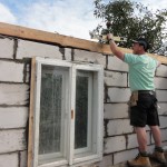 Richard working on the wooden frame to support the roof