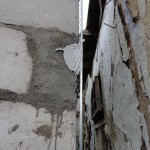 Angle bead mounted on the corner of the house