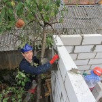 Me pointing the top of the house