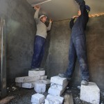 AJ and I attaching the last piece of plasterboard