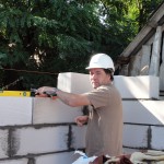 Stuart laying blocks in the second house
