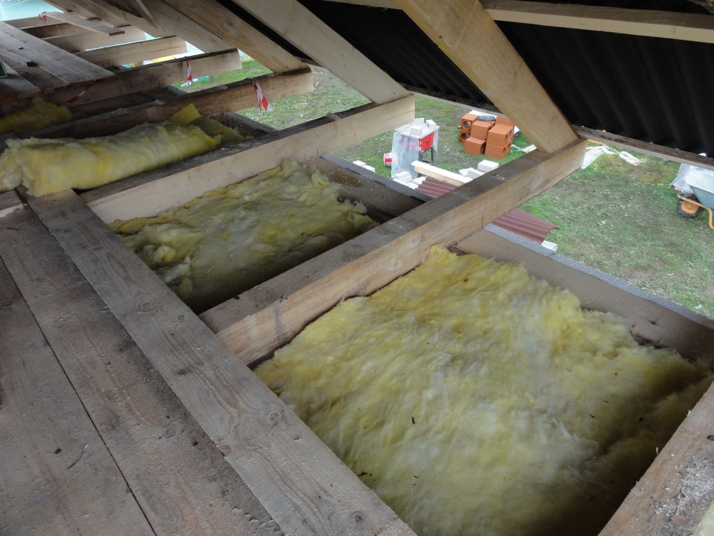 Insulation being installed in the loft